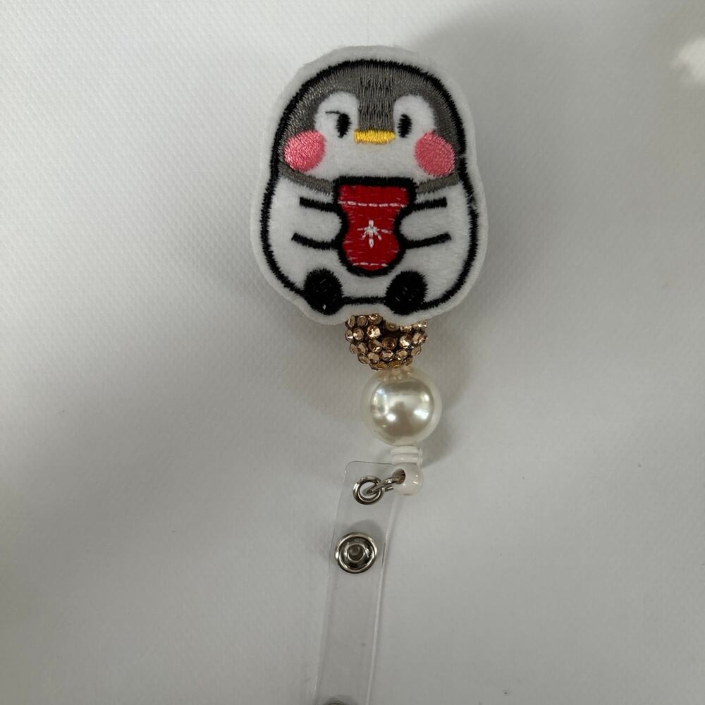 Penguin Badge Reel